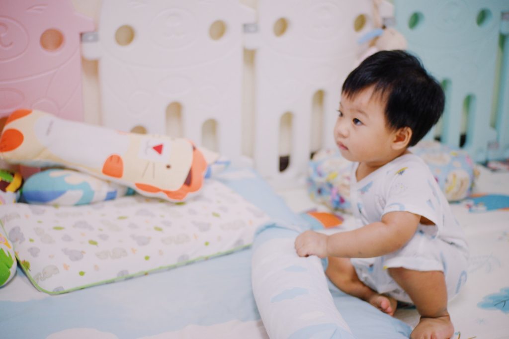 Cute asian child lying on bed